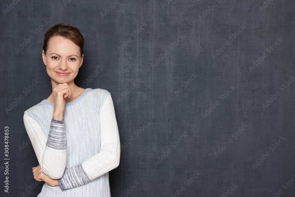 Portrait of happy young woman smiling cheerfully, being in good mood Portrait of happy young woman smiling cheerfully, being in good mood