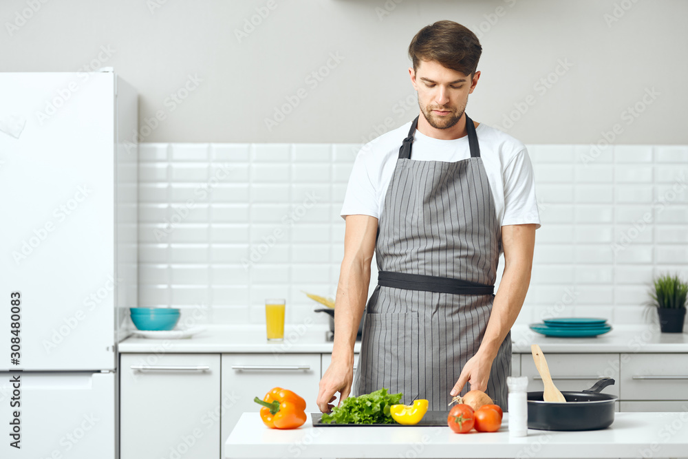 man preparing food in the kitchen man preparing food in the kitchen
