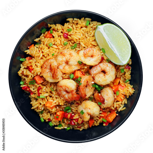 Fried Rice with fresh shrimp, rice, green onions, vegetables and lime in a bowl. Healthy Thai food isolated on white background. Top view, directly above shot with space for text.