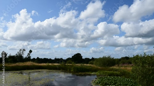 Timelapse of scurrying clouds and a pond on Wetley Moor Staffordshire. photo