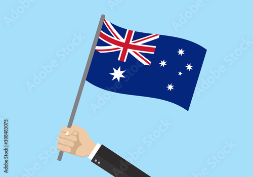 Australia waving flag. Hand holding Australian flag. National symbol with Southern Cross constellation. Vector illustration. 