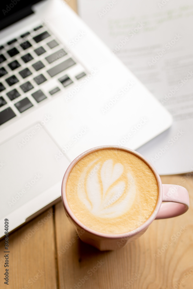 Work in a coffee shop with a laptop.Work over a cup of coffee.A laptop with glasses, a notebook and a magazine.Computer on the table.The working process.Rest for the soul.Valentine's Day Work in a coffee shop with a laptop.Work over a cup of coffee.A laptop with glasses, a notebook and a magazine.Computer on the table.The working process.Rest for the soul.Valentine's Day