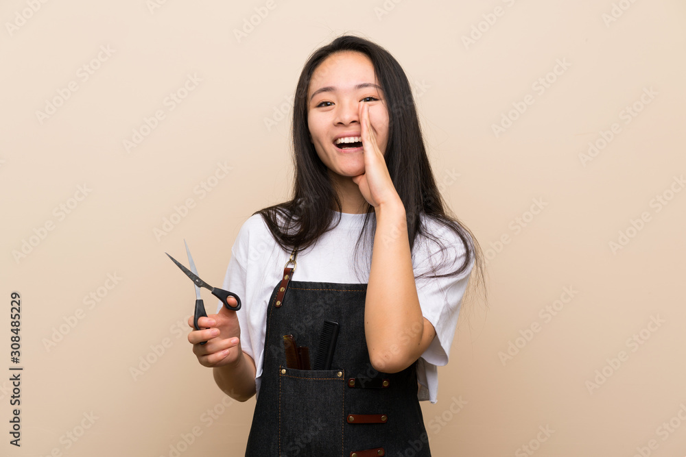 Teenager hairdresser girl shouting with mouth wide open Teenager hairdresser girl shouting with mouth wide open