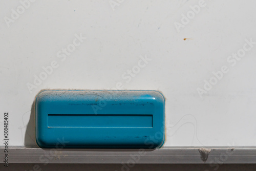 A whiteboard eraser that has not been used for a long time.