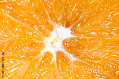 Orange close-up macro. Juicy fruit cut in half.