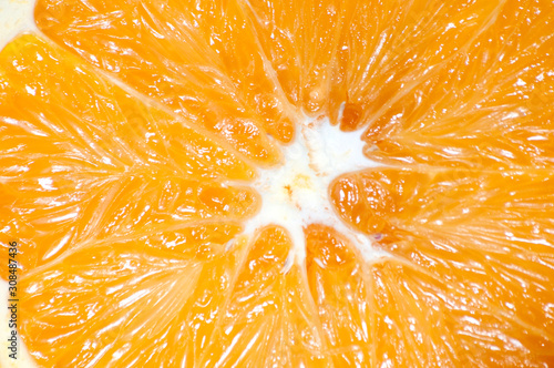 Orange close-up macro. Juicy fruit cut in half.