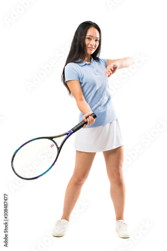 Young asian tennis player over isolated white background