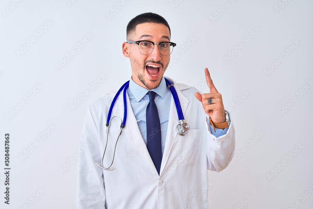 Young doctor man wearing stethoscope over isolated background pointing finger up with successful idea. Exited and happy. Number one. Young doctor man wearing stethoscope over isolated background pointing finger up with successful idea. Exited and happy. Number one.