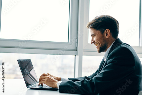 businessman working on laptop in office © SHOTPRIME STUDIO