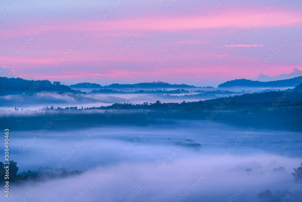Amazing beautiful landscape view of mountains hill with fog dawn colourful sky in the morning.