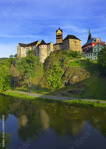 Loket Castle - the 12th-century Gothic style castle, located about 12 km from Karlovy Vary on a massive rock in the town of Loket, Czech Republic photo