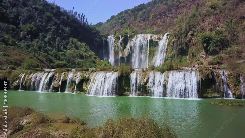 Aerial view drone flight above Jiulong waterfall in Luoping, Yunnan, China Aerial view drone flight above Jiulong waterfall in Luoping, Yunnan, China