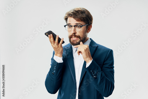 young man talking on the phone isolated on white