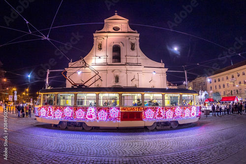 Christmas special tram illuminated by light with Christmas motif in Brno on traditional Moravian markets.