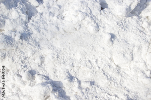 A snow pile in a sunny day as a background