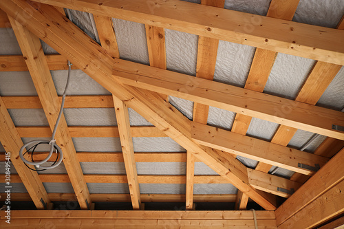 Wooden construction of the roof of a country house, bathhouse. The process of building a summer house.