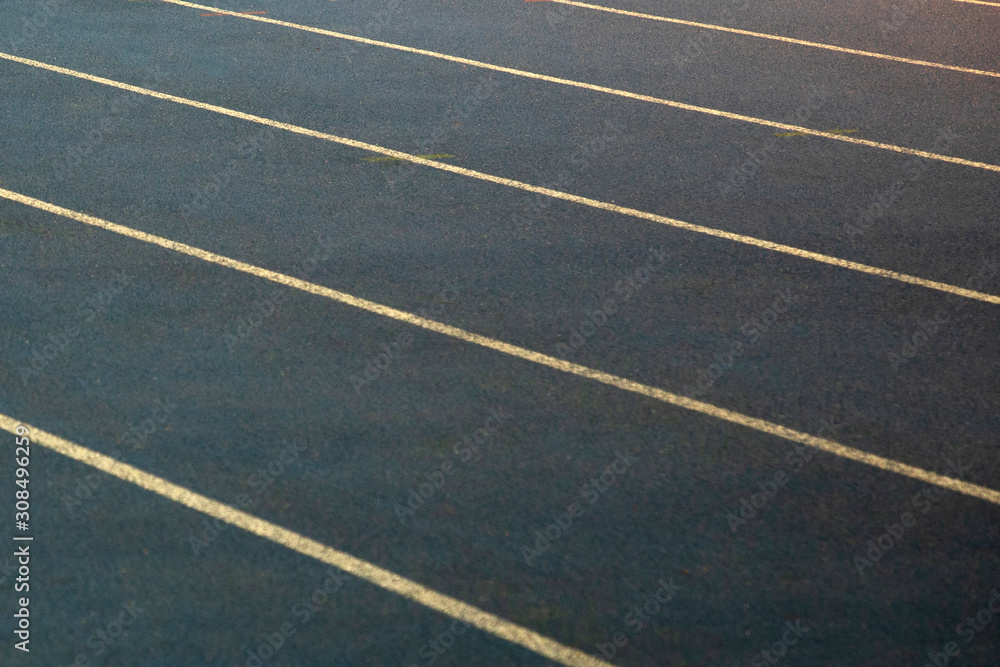 Gray treadmills in the stadium, close-up. Running tracks with marking. Stadium for professional athletes.