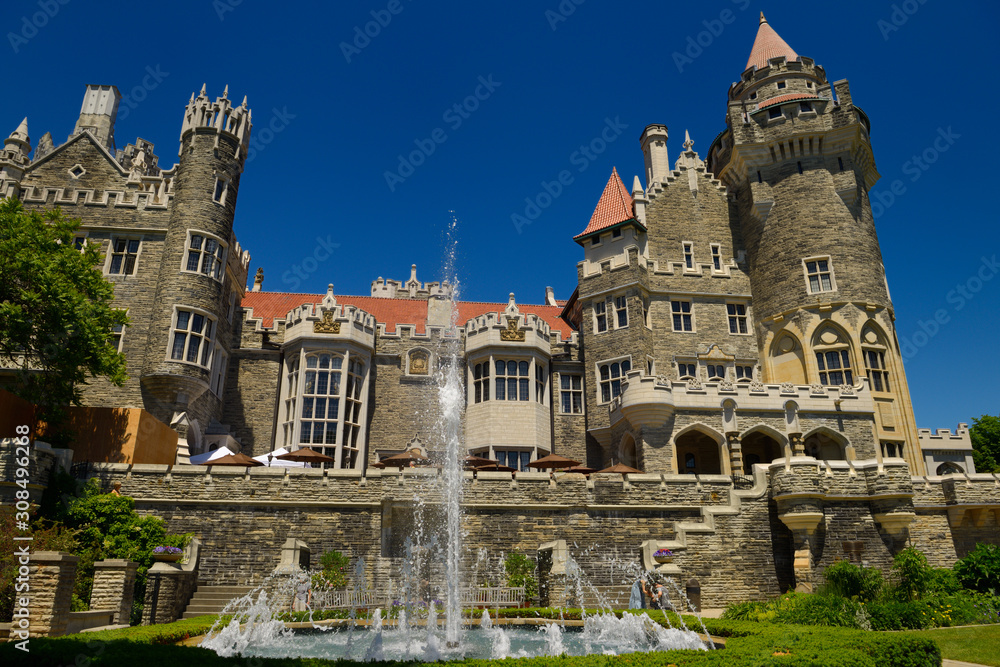 Obraz premium Gothic revival architecture of Casa Loma castle in Toronto with garden fountain