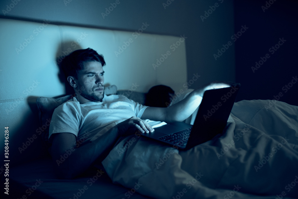 Fototapeta premium man sitting on sofa and watching tv