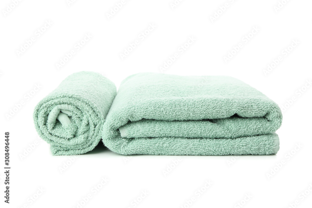 Folded fresh green towels isolated on white background Folded fresh green towels isolated on white background