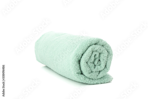 Rolled green towel isolated on white background, close up