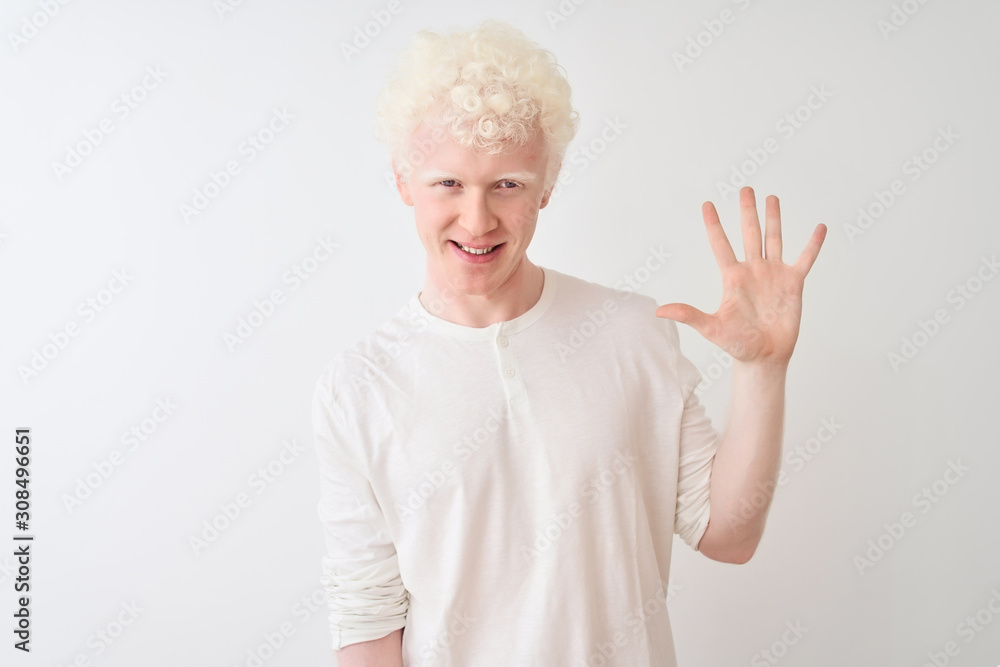 Young albino blond man wearing casual t-shirt standing over isolated white background showing and pointing up with fingers number five while smiling confident and happy. Young albino blond man wearing casual t-shirt standing over isolated white background showing and pointing up with fingers number five while smiling confident and happy.