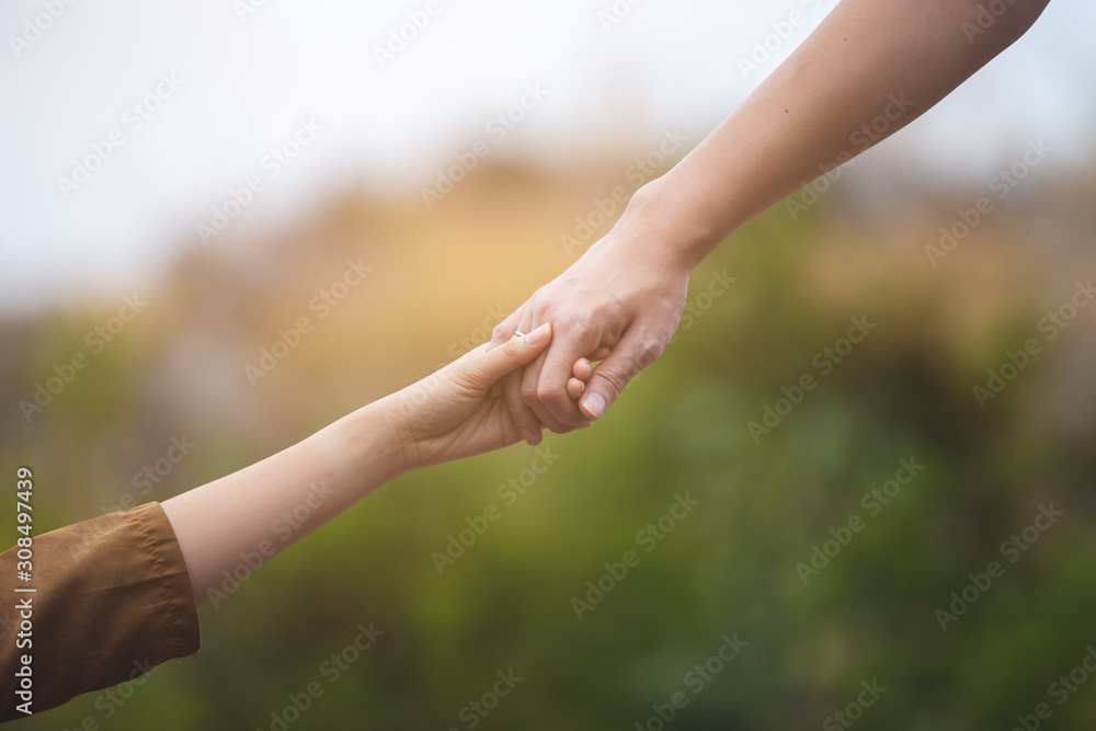 close up hands up man and woman holding hand together, love and help concept. close up hands up man and woman holding hand together, love and help concept.