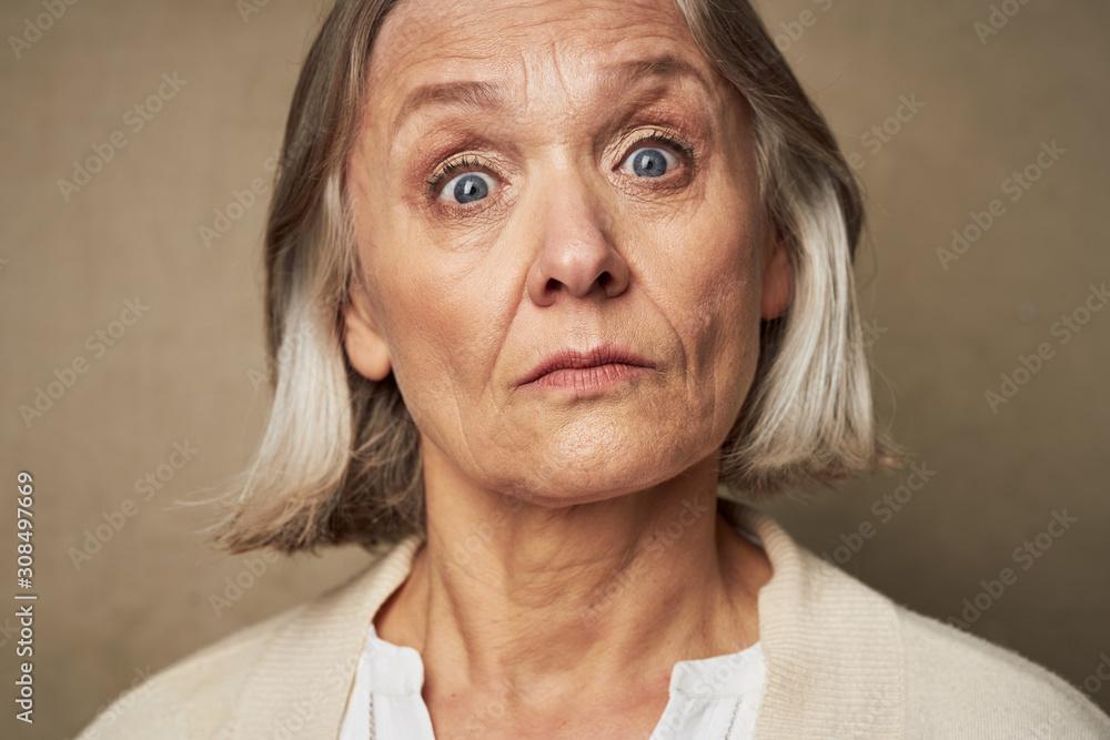 portrait of senior woman smiling at camera portrait of senior woman smiling at camera