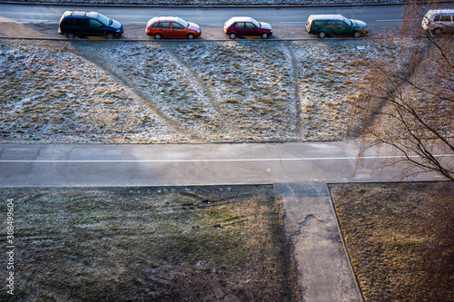 cars parked on the street in suburbs in winter