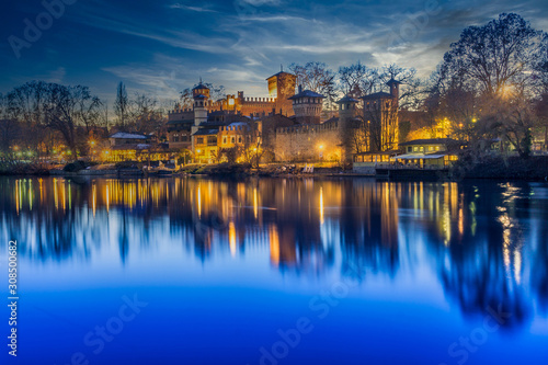 medieval village of turin at blue hour, park of valentino, along the river po