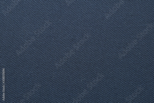 Close up shot of midnight dark blue formal suit cloth textile surface. wool fabric texture for important luxury evening or night event. Wallpaper and background with copy space for text