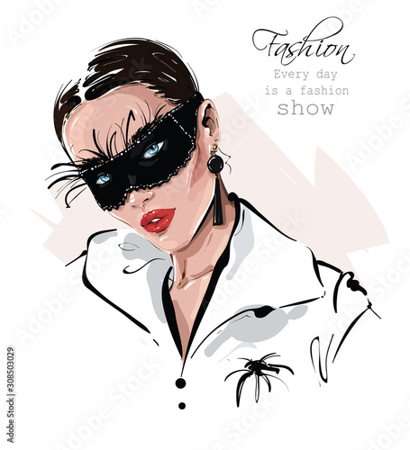 Hand drawn beautiful young woman in black carnival mask with feathers. Stylish girl. Fashion woman look. Sketch. Vector illustration.