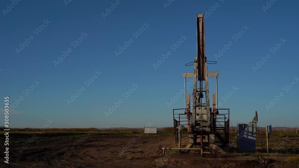 Oil production, oil pumping at dawn