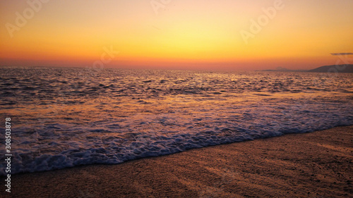 combination of Sunset and Beach. colorful orange sunset at the beach.