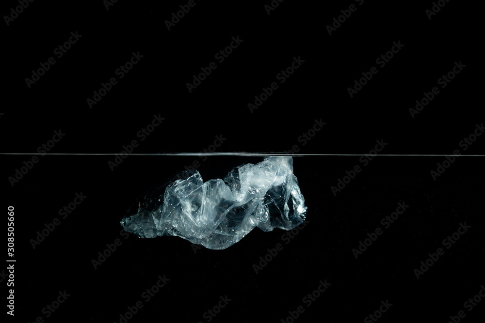 Plastic bag floating in the ocean with copy space. Plastic waste underwater. Pollution concept. Plastic bag floating in the ocean with copy space. Plastic waste underwater. Pollution concept.