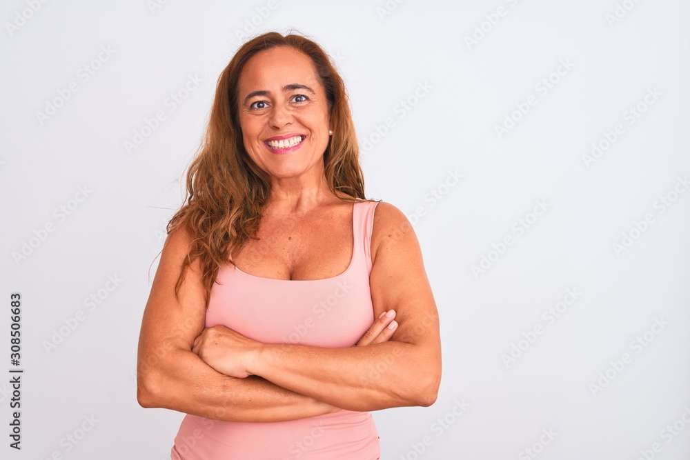 Middle age mature woman standing over white isolated background happy face smiling with crossed arms looking at the camera. Positive person. Middle age mature woman standing over white isolated background happy face smiling with crossed arms looking at the camera. Positive person.