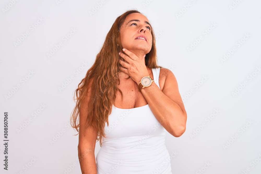 Middle age mature woman standing over white isolated background Touching painful neck, sore throat for flu, clod and infection Middle age mature woman standing over white isolated background Touching painful neck, sore throat for flu, clod and infection