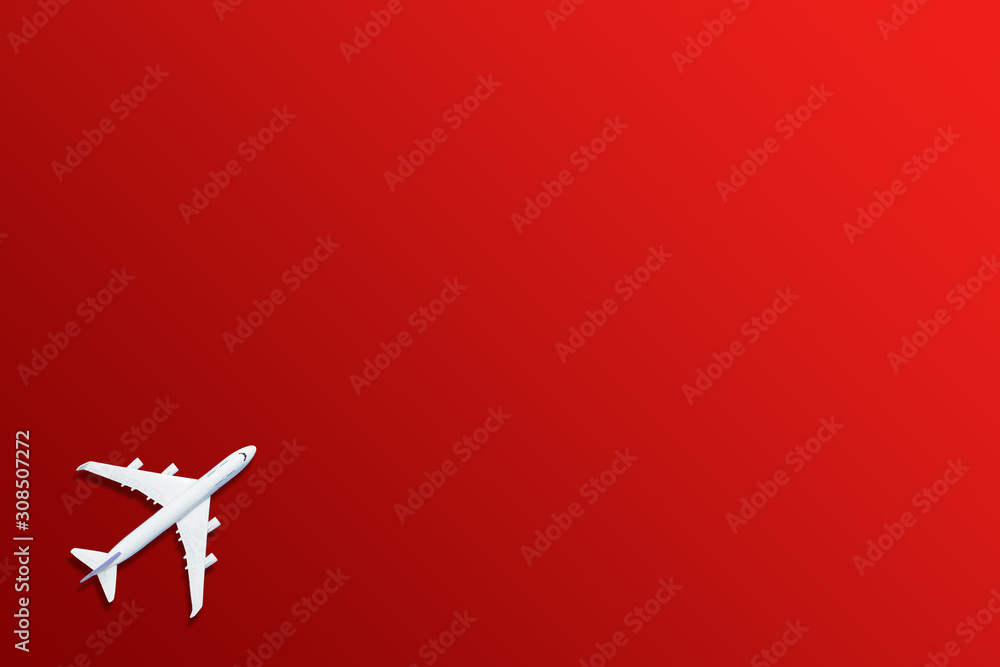 Fototapeta premium Airplane model. White plane on red background.