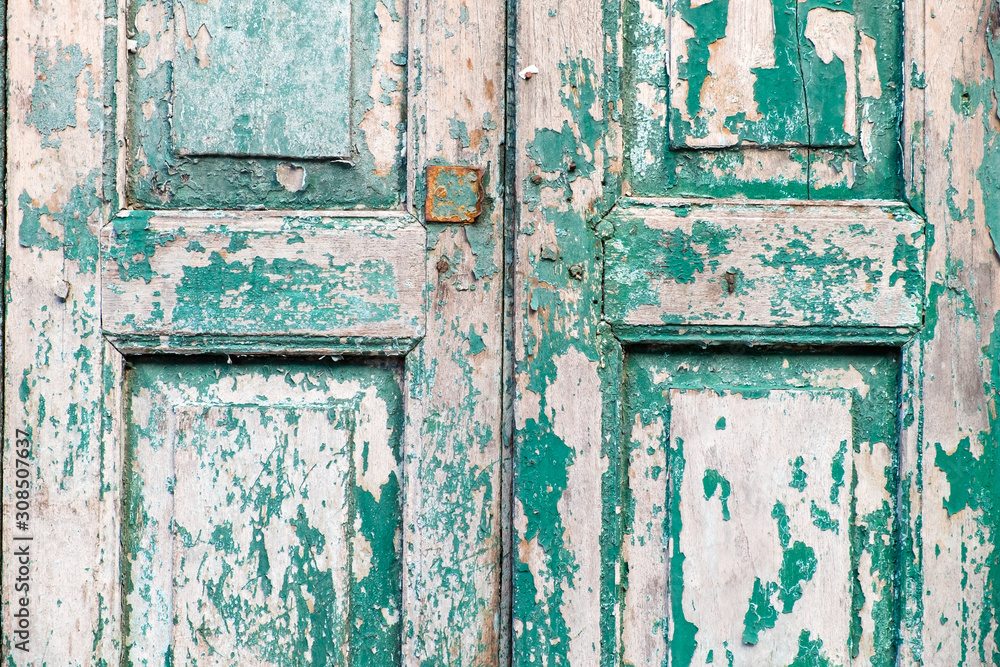 Old wooden door, green, black ground texture Old wooden door, green, black ground texture