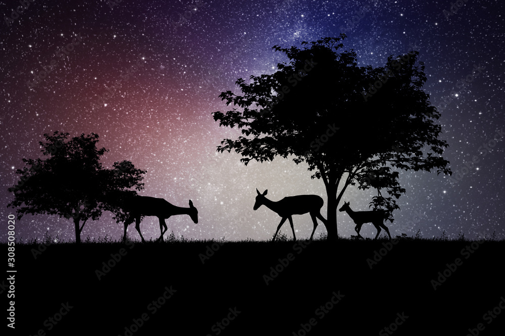 silhouettes of deer under a tree at night silhouettes of deer under a tree at night