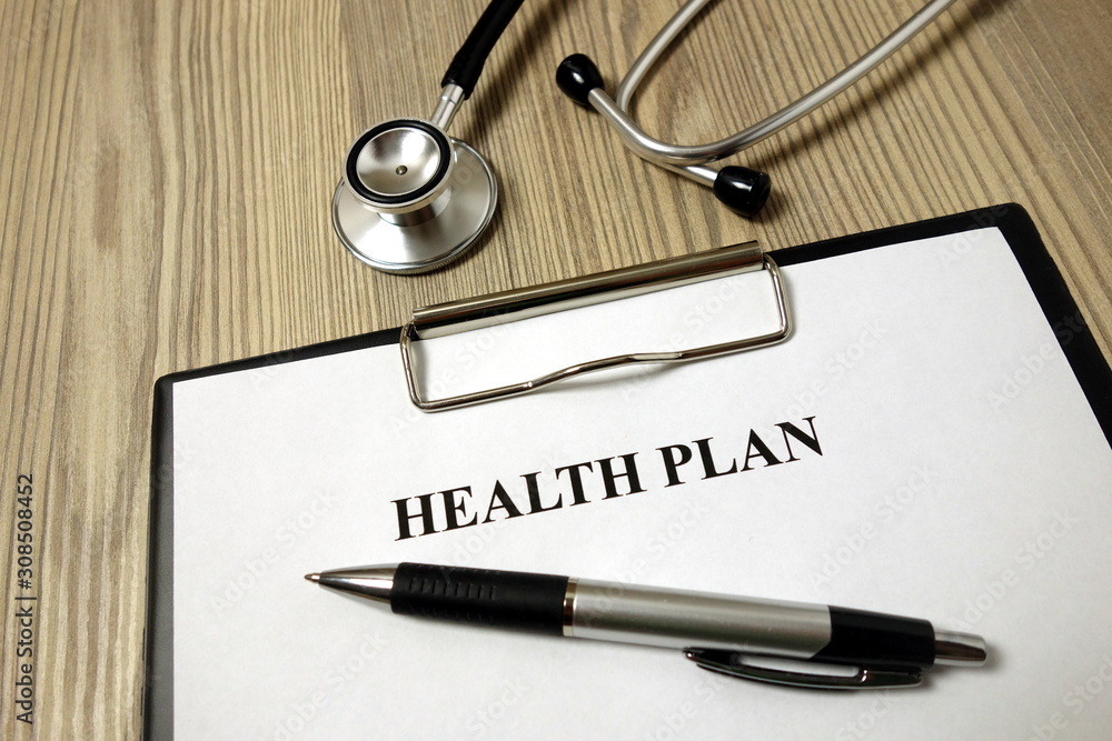 Health plan paper with pen and stethoscope Health plan paper with pen and stethoscope