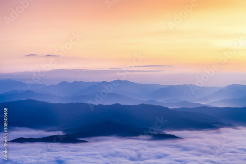 Beautiful fog coverage mountain valley and sunlight in the morning colorful,Sri Nan Park,Nan,Thailand © Anukool