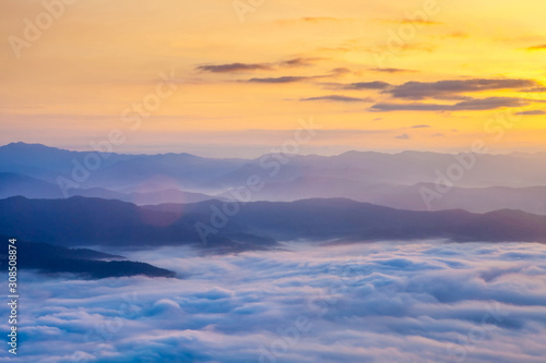 Beautiful fog coverage mountain valley and sunlight in the morning colorful,Sri Nan Park,Nan,Thailand © Anukool