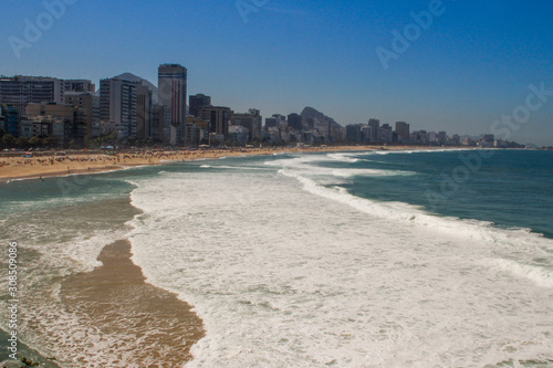 The most popular and famous beach of Brazil and Rio de Janeiro - Ipanema and Copacobana, relaxing on the beach among the rocks, sand and palm trees. The famous beaches 