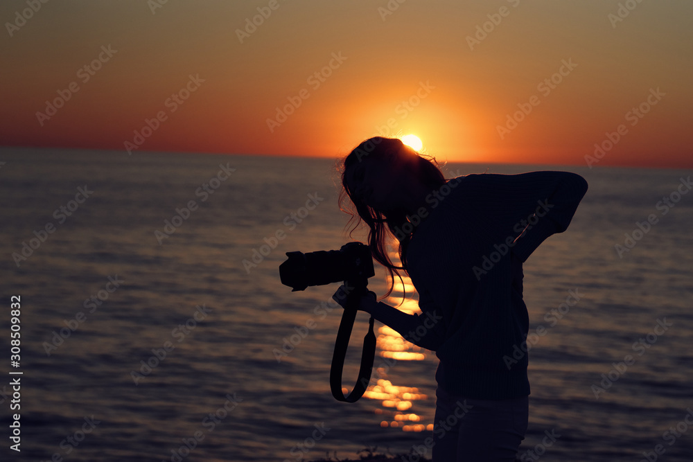 silhouette of girl on the beach at sunset