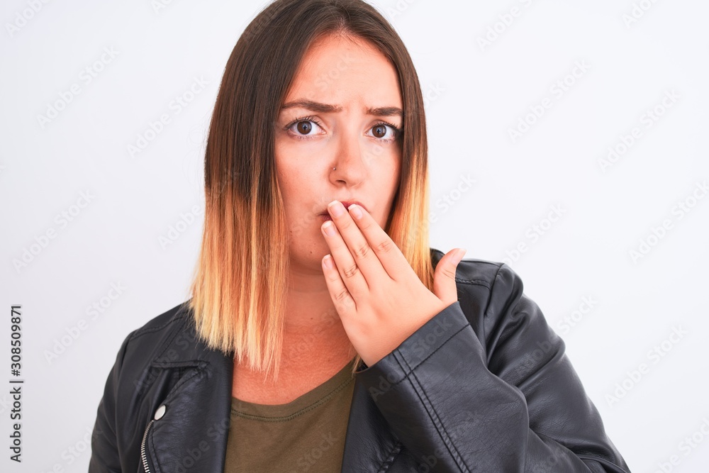 Young beautiful woman wearing t-shirt and jacket standing over isolated white background cover mouth with hand shocked with shame for mistake, expression of fear, scared in silence, secret concept Young beautiful woman wearing t-shirt and jacket standing over isolated white background cover mouth with hand shocked with shame for mistake, expression of fear, scared in silence, secret concept