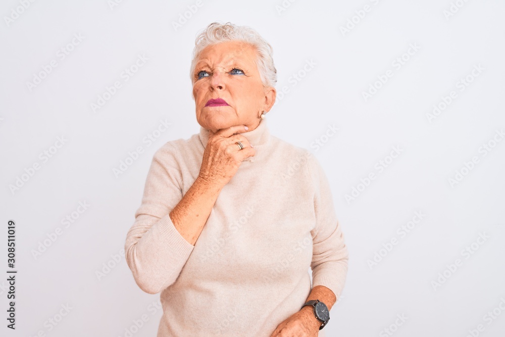 Senior grey-haired woman wearing turtleneck sweater standing over isolated white background Touching painful neck, sore throat for flu, clod and infection Senior grey-haired woman wearing turtleneck sweater standing over isolated white background Touching painful neck, sore throat for flu, clod and infection