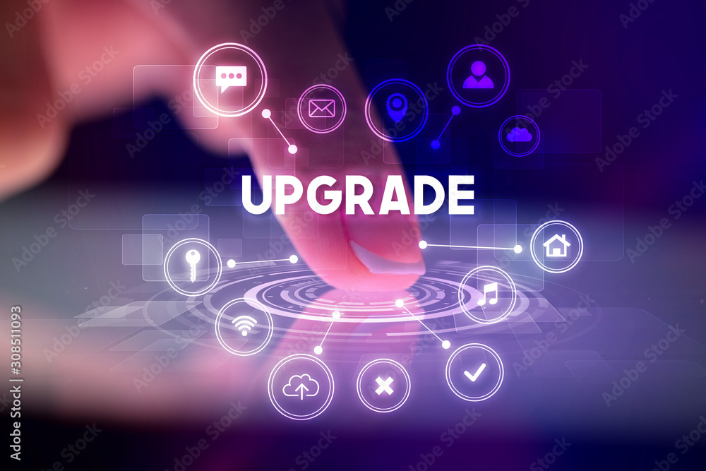 Finger touching tablet with web technology icons and UPGRADE inscription, web technology concept Finger touching tablet with web technology icons and UPGRADE inscription, web technology concept