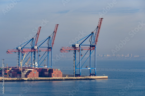 Cargo port cranes. Sea landscape.