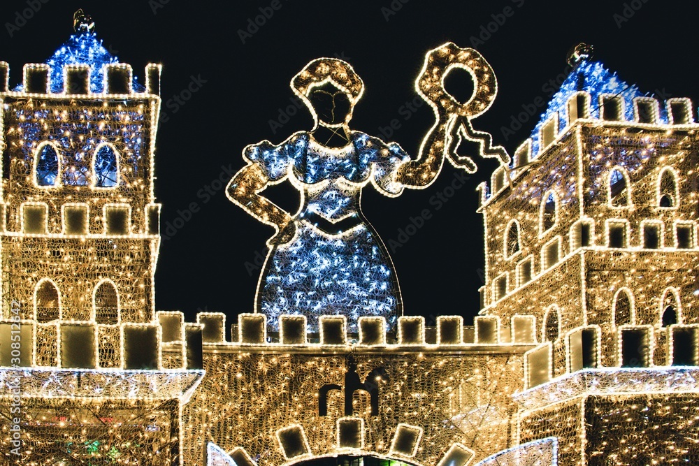 Illuminated castle with Christmas decorations on black background in Magdeburg, Germany - obrazy, fototapety, plakaty 
